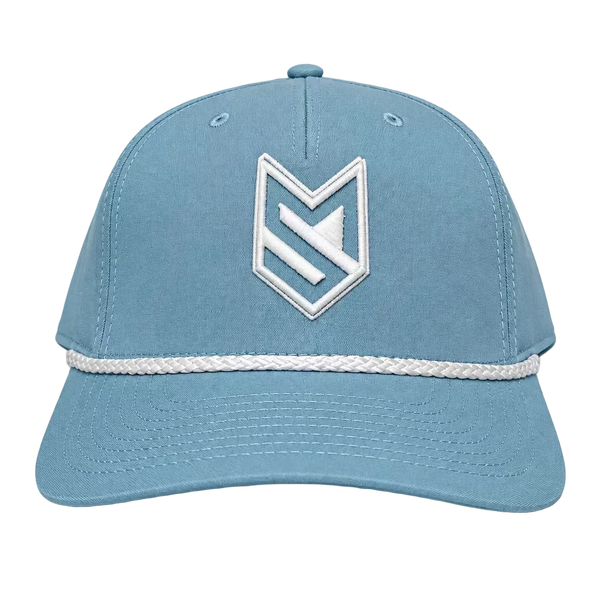 A light blue baseball cap with a white embroidered geometric logo on the front and a white braided stripe detail across the brim, displayed on a white surface with a white paneled door in the background.