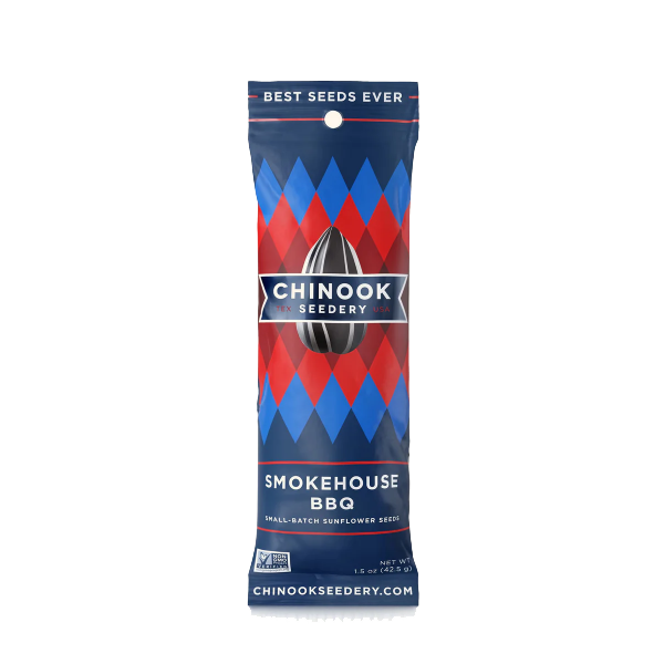 A package of Chinook Sunflower Seeds branded as Smokehouse BBQ flavor. The packaging is predominantly red and blue with an image of a sunflower seed in the center and the text 'Best Seeds Ever' at the top.