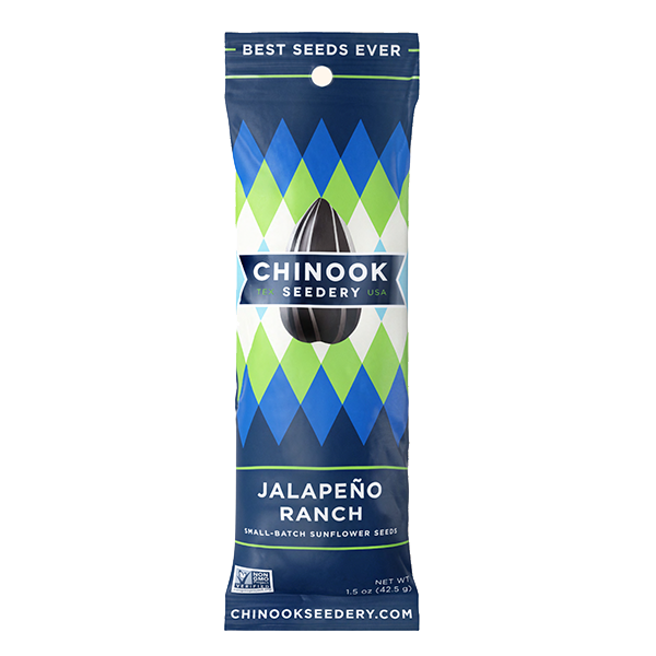 A package of Chinook Sunflower Seeds branded as Smokehouse BBQ flavor. The packaging is predominantly red and blue with an image of a sunflower seed in the center and the text 'Best Seeds Ever' at the top.