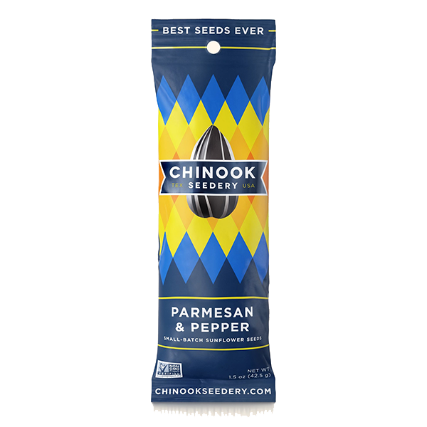 A package of Chinook brand Parmesan & Pepper sunflower seeds by Motivate Sportz, Inc. with a blue and yellow geometric pattern on the packaging.