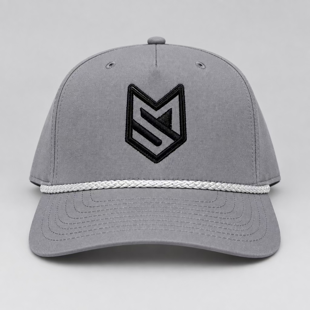 A gray structured baseball cap with a black embroidered geometric logo on the front and a white braided rope detail across the brim, shown against a light gray background.