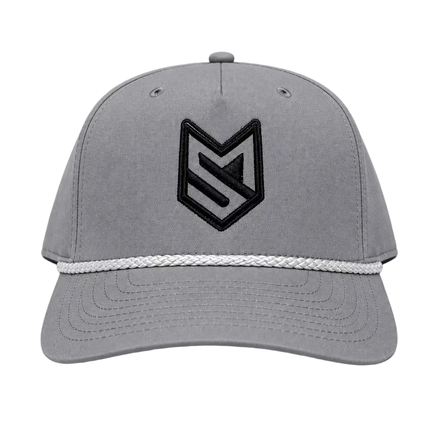 A gray structured baseball cap with a black embroidered geometric logo on the front and a white braided rope detail across the brim, shown against a light gray background.